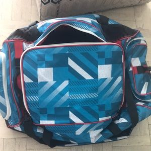 OGIO TRUCKER 8800 - never used red/turquoise/white/black geometric pattern